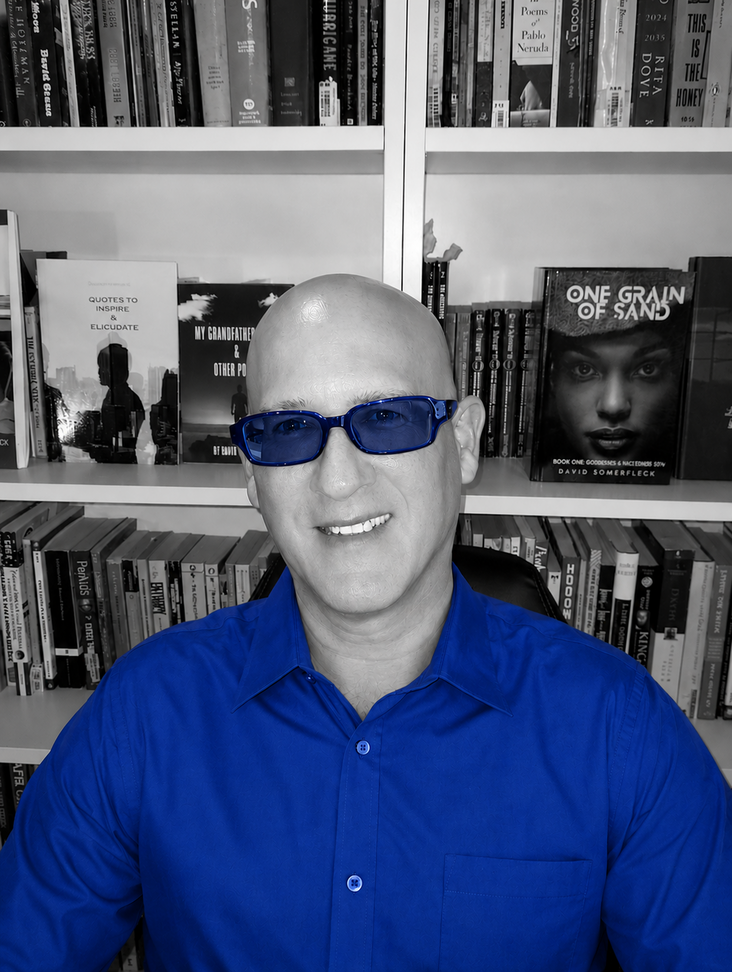 Speculative Fiction Author David Somerfleck Smiling At Bookshelf